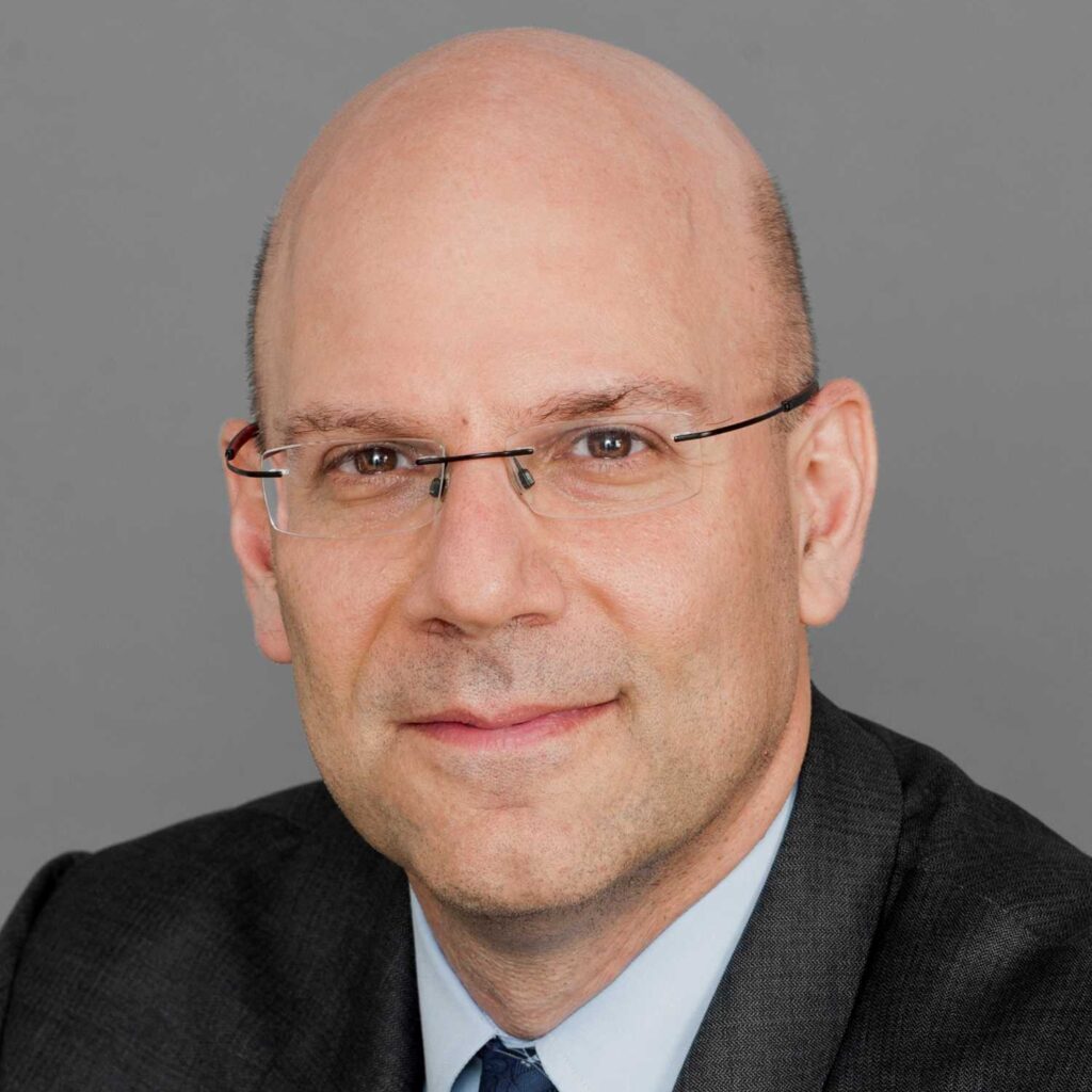 A headshot of Dean Joel Hellman.